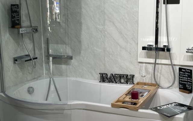 41 - LAZA Bathroom Showroom -  Edmonton - Shower bath featuring a curved shower panel