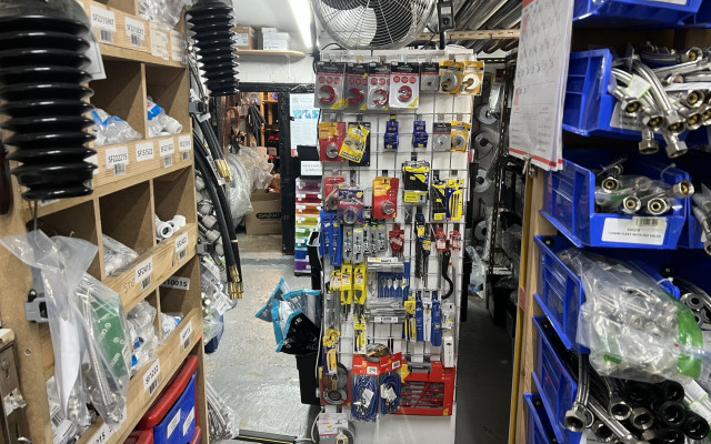 A variety of plumbing hand tools and accessories on display